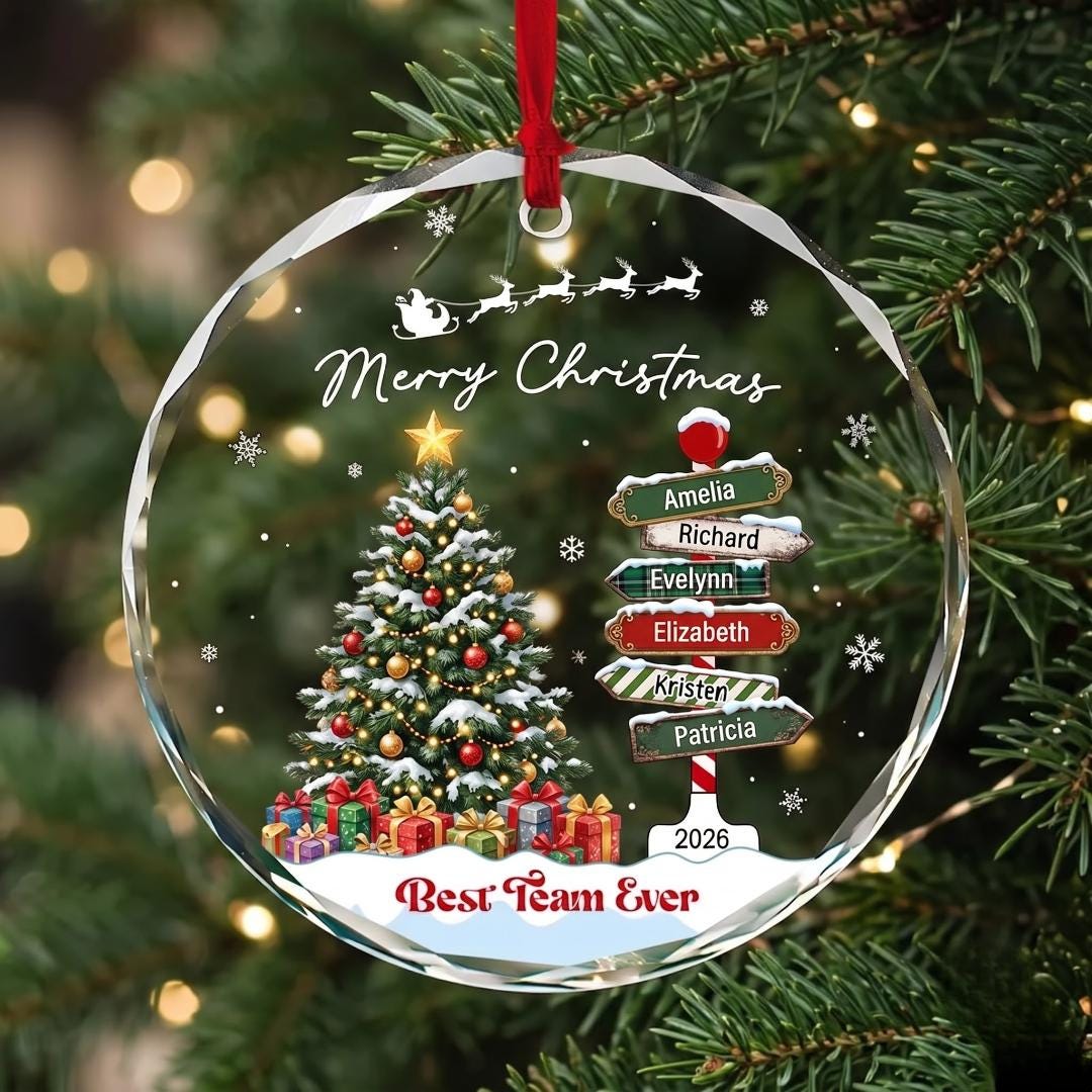 Personalized Best Team Ever glass ornament with a Christmas tree and team names on a signpost