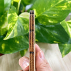 Side view showing the thin plywood edge of the 250 Years of America wooden ornament
