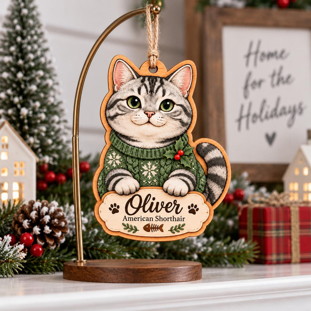 American Shorthair cat in green sweater wooden ornament on a display stand by a mantel