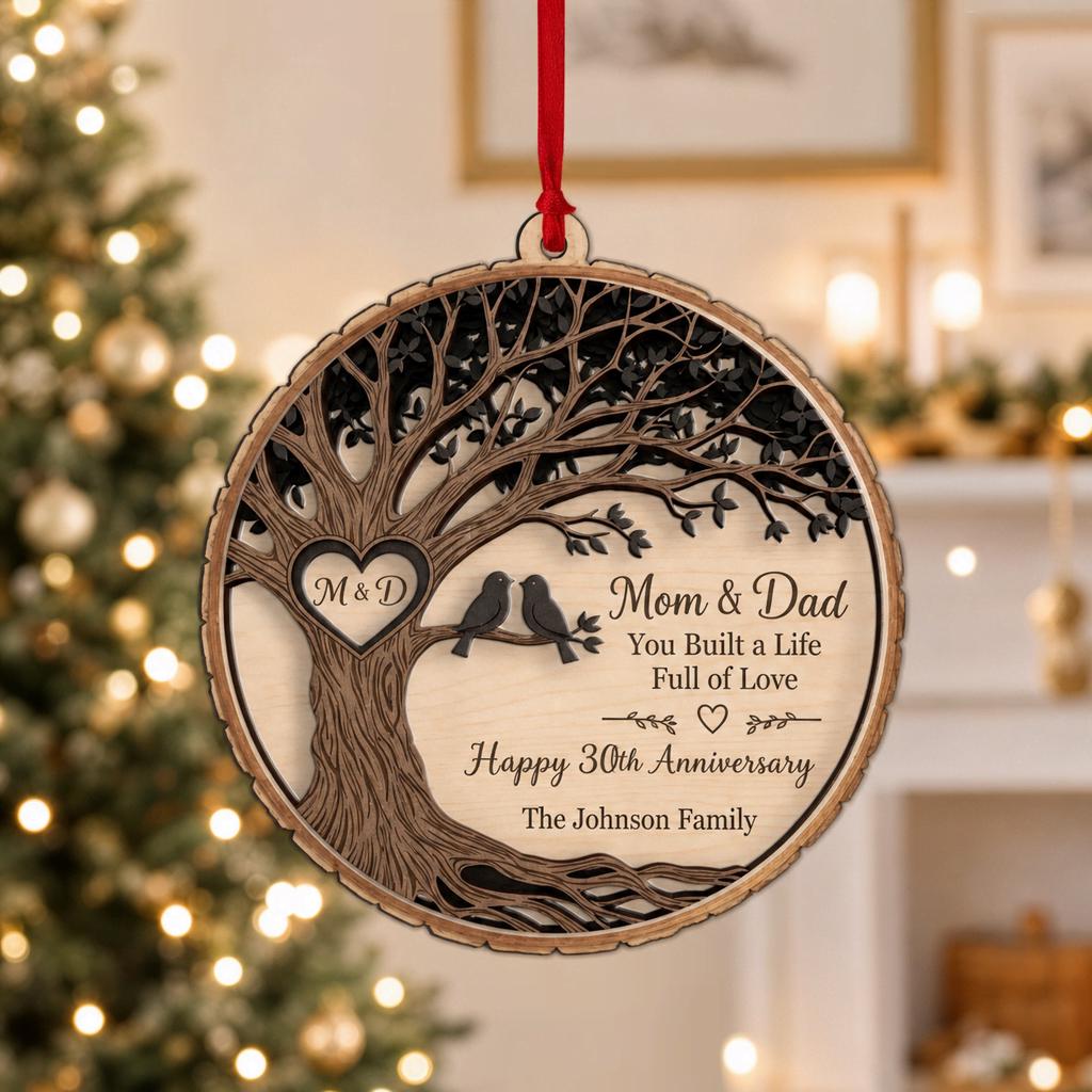 Family tree anniversary ornament with lovebirds and heart initials in a festive living room