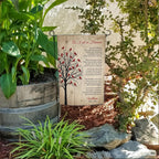 As I Sit In Heaven cardinal tree poem memorial garden flag with name in a flower bed beside a wooden barrel planter