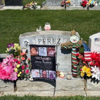 Customer photo of an In Loving Memory photo collage flag at a headstone with flowers