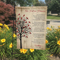 As I Sit In Heaven cardinal tree poem memorial garden flag with name in a garden bed with yellow lilies