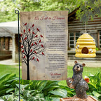 As I Sit In Heaven cardinal tree poem memorial garden flag with name on a garden stand by a log cabin with a beehive and bear statue