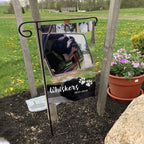 Example of another personalized pet memorial flag with a dog photo and name, shown in a yard