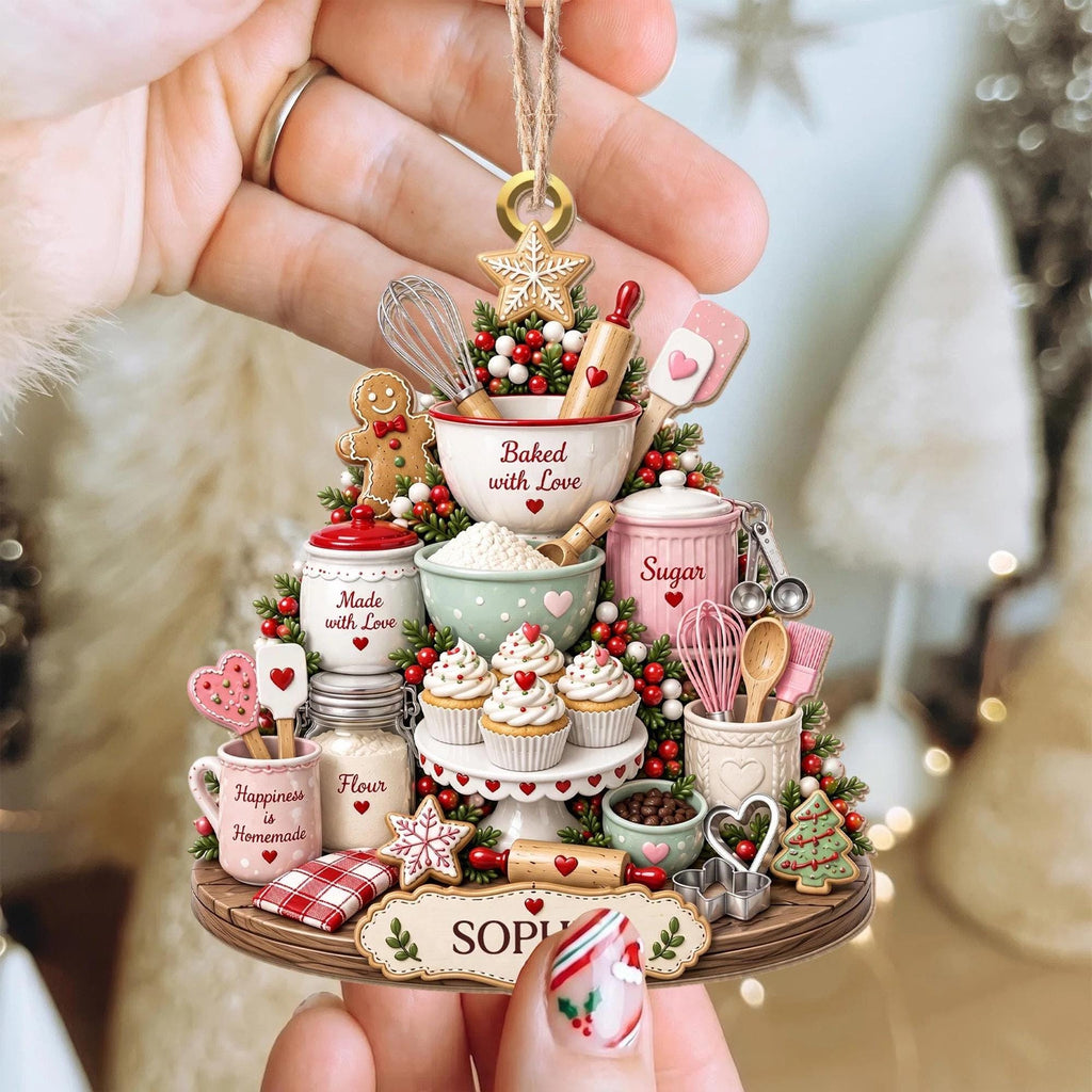 Hand holding the Baked with Love baking ornament
