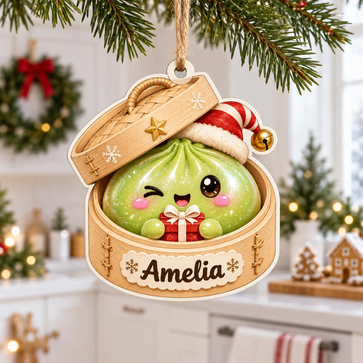 Green winking bao dumpling in a Santa hat holding a gift in a steamer ornament
