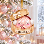 Pink bao dumpling with earmuffs and candy cane in a bamboo steamer wooden ornament
