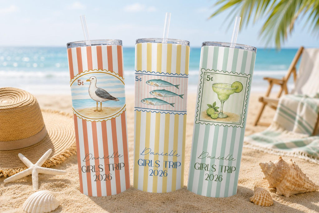 Beach tumblers with seagull, fish and margarita stamp designs on the sand