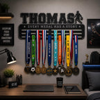 Black basketball medal holder with name Thomas in a teen bedroom