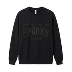 Black Spooky Season embroidered Halloween sweatshirt with arched collegiate lettering and flying bats