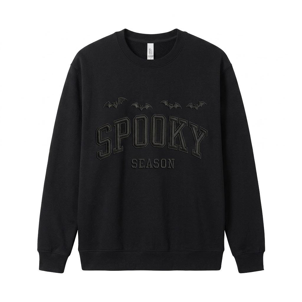 Black Spooky Season embroidered Halloween sweatshirt with arched collegiate lettering and flying bats