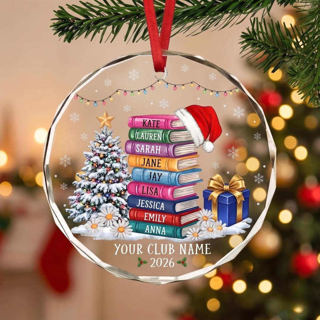 Personalized book club glass ornament with a stack of named books and a Santa hat
