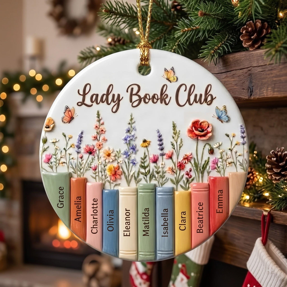 Book club names ornament under pine and pinecones by a cozy fireplace