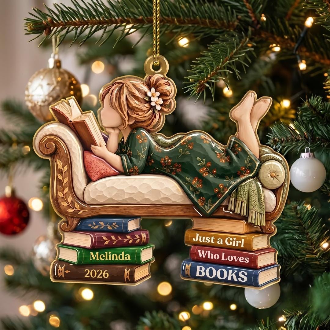 Girl reading on a vintage sofa book lover ornament hanging on a Christmas tree