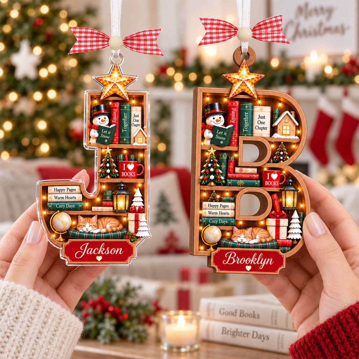Book lover letter ornaments J and B held in two hands