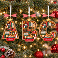 Bookshelf letter ornaments A, B and C with names on a tree