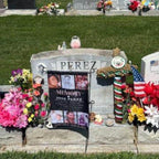 Customer photo of an In Loving Memory photo collage flag at a headstone with flowers