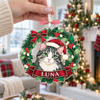 Hand holding a custom cat portrait wreath ornament