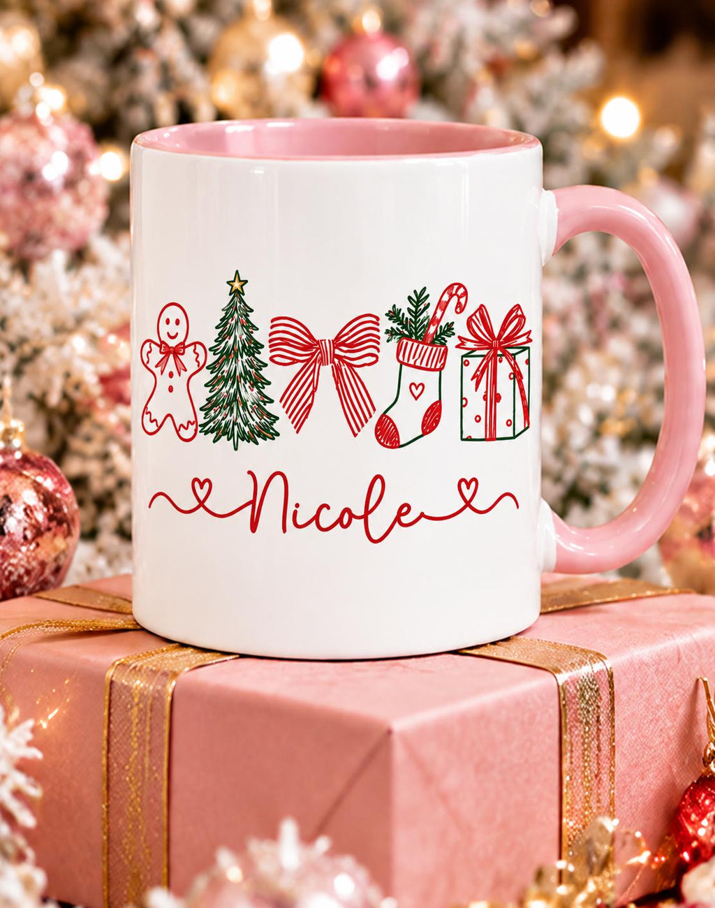 Pink handle Christmas name mug with gingerbread, tree, bow, stocking and gift design