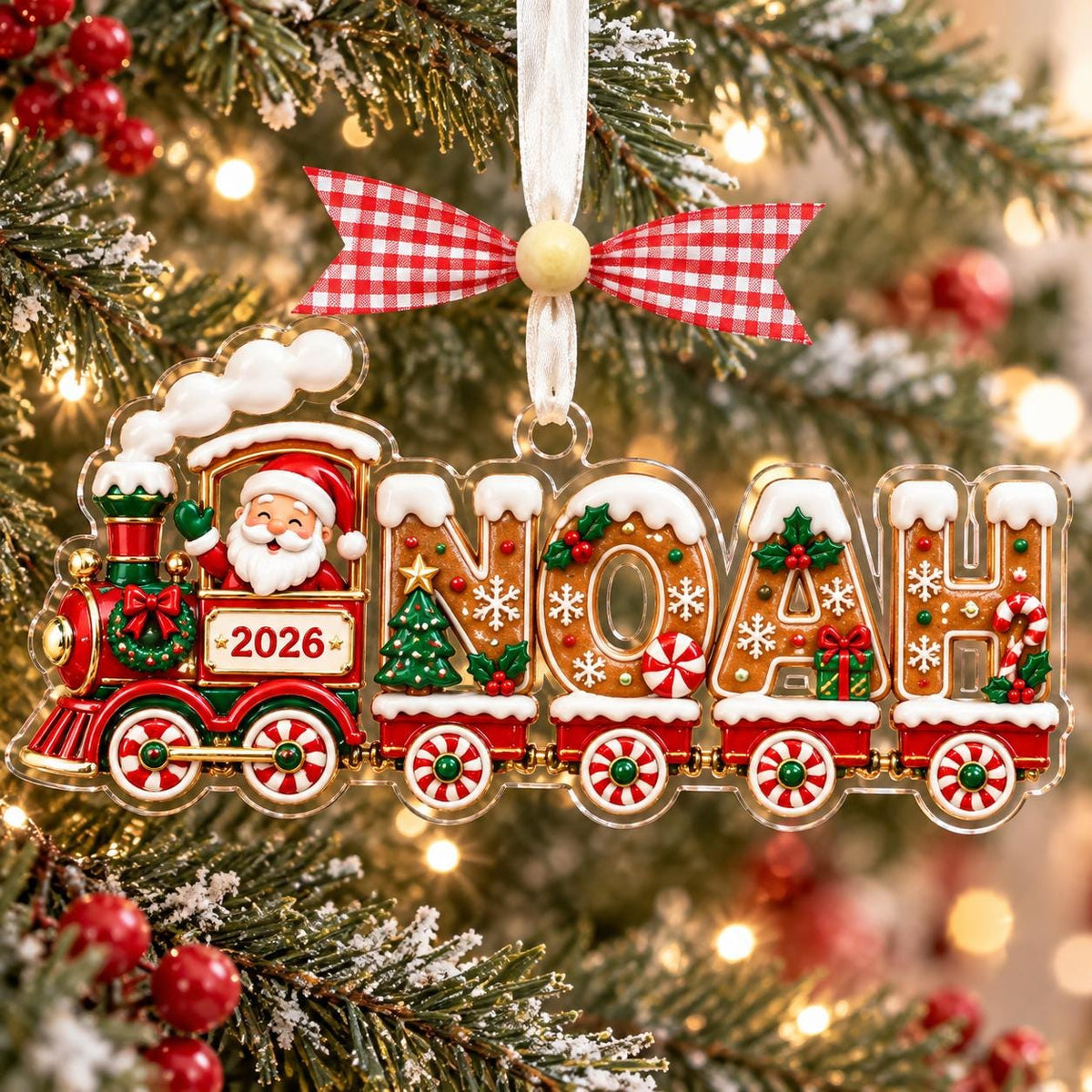 Gingerbread name train ornament hanging by Christmas lights