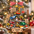 Construction truck tree ornament with Lucas 2026 on a tree