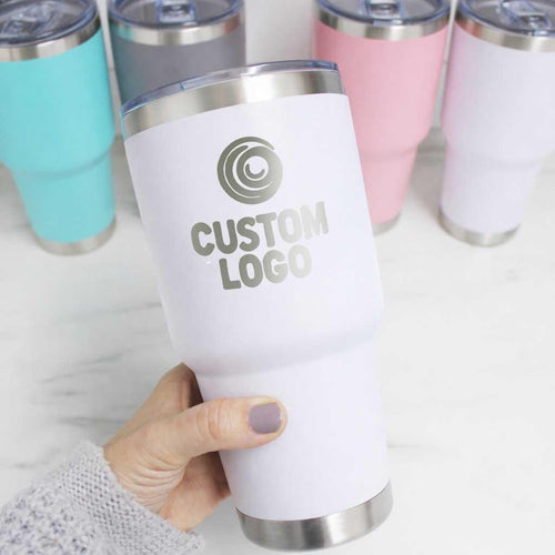 White 30oz tumbler laser engraved with a custom company logo