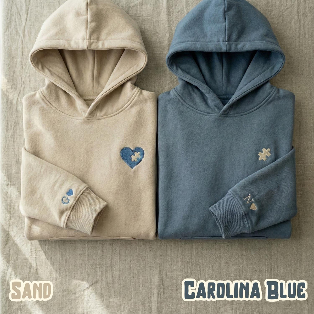 Sand and Carolina blue couple hoodies with a blue puzzle heart and puzzle piece