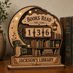 Crescent moon book tracker with a green armchair and stars, reading Jackson's Library, beside classic novels