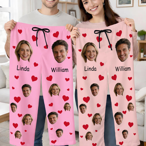 Couple holding pink custom face pajama pants with names Linda and William