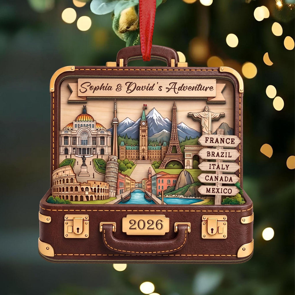 Destination keepsake suitcase ornament on a lit tree