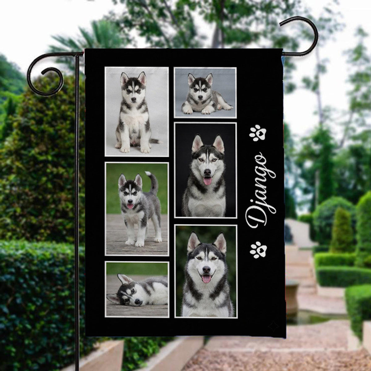 Custom dog photo collage garden flag with name on black beside a stone garden path