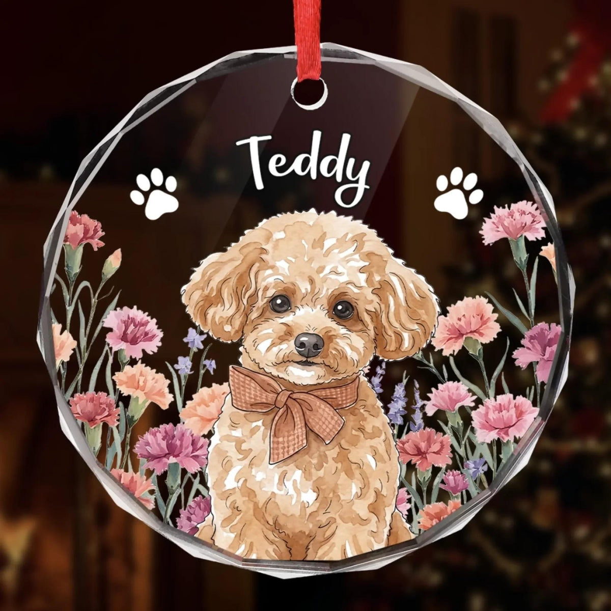 Close-up of the Teddy dog portrait glass ornament with paw prints and flowers