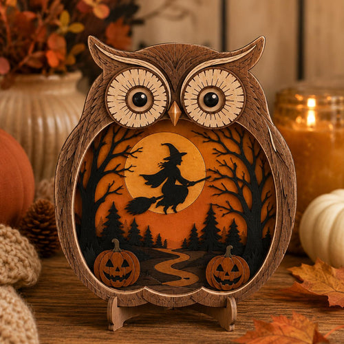 Layered wooden owl decor with a witch flying across an orange harvest moon