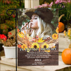 Fall memorial photo garden flag with sunflowers, poem and name on porch steps with pumpkins and flowers