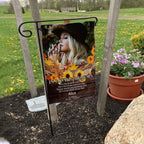 Fall memorial photo garden flag with sunflowers, poem and name on a garden flag stand in a yard with potted flowers
