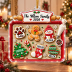 Family name cookie ornament on a tree with wrapped gifts