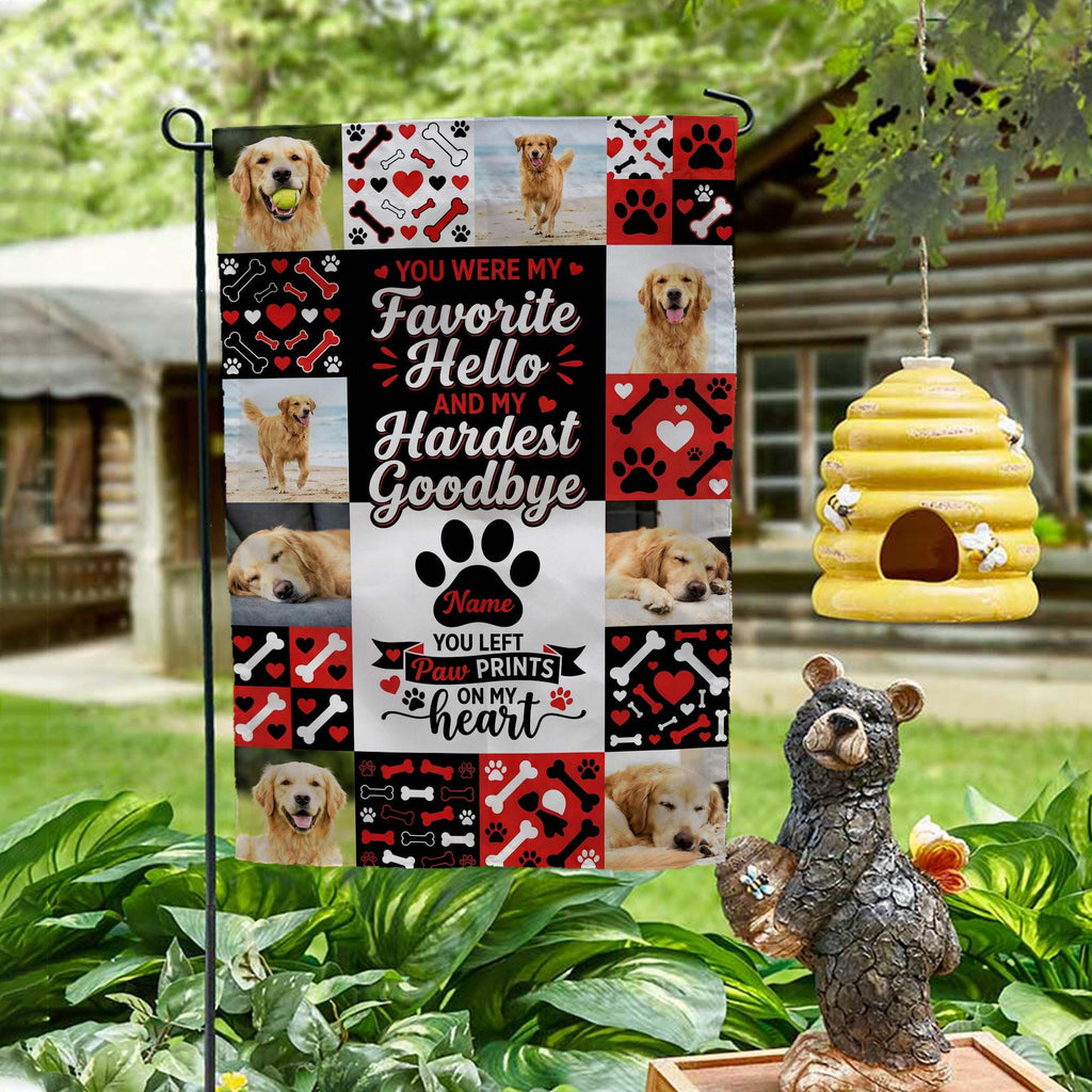 Favorite Hello Hardest Goodbye dog memorial photo collage garden flag on a garden stand by a log cabin with a beehive and bear statue