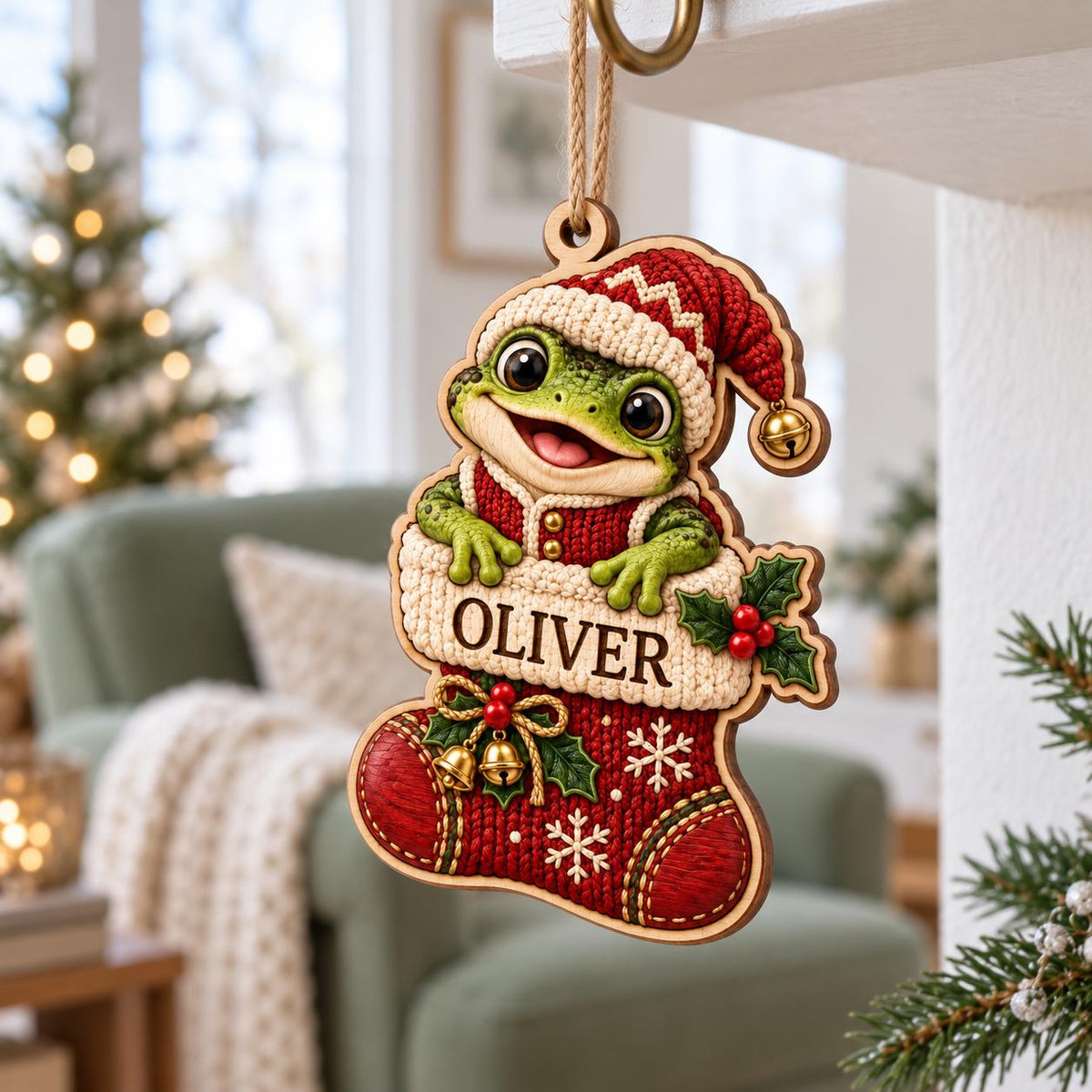 Frog in red knit stocking wooden ornament hanging beside a decorated Christmas tree