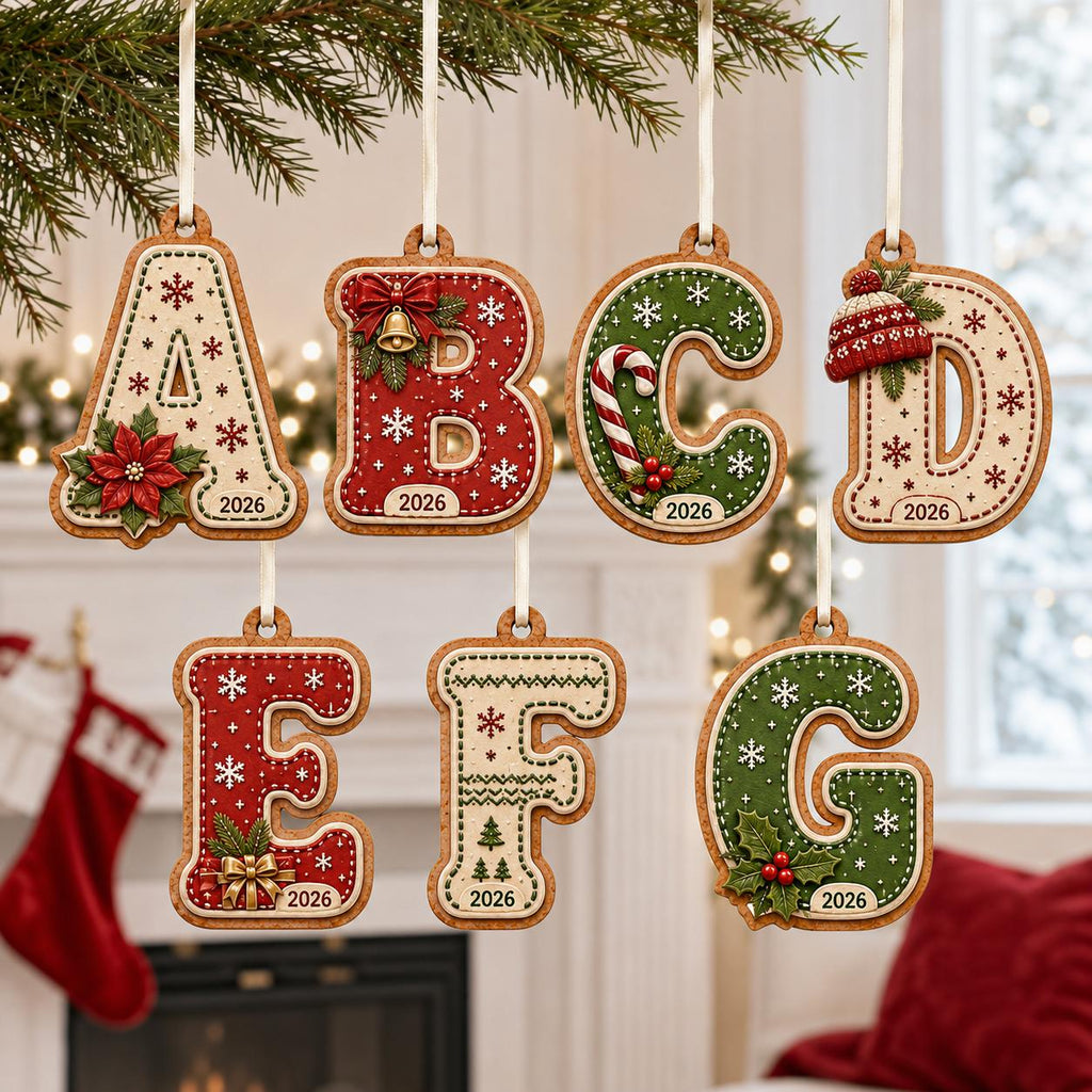 Gingerbread alphabet 2-layer letter ornaments A to G with year hanging by a fireplace
