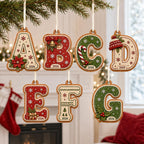 Gingerbread alphabet 2-layer letter ornaments A to G with year hanging by a fireplace