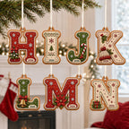 Gingerbread letter ornaments H to N in red, cream and green with 2026