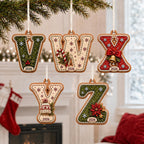 Gingerbread letter ornaments V to Z with holiday motifs and year hanging by stockings