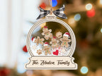 Gingerbread cookie family ornament by a bright window