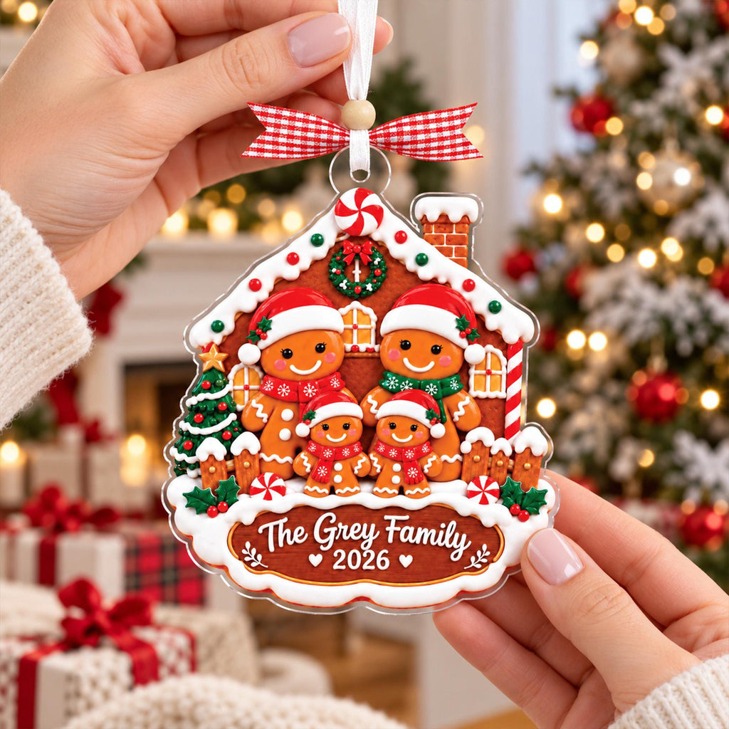 Gingerbread family ornament held in two hands
