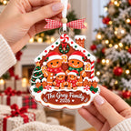 Gingerbread family ornament held in two hands