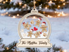 Gingerbread family snow globe ornament over a snowy background