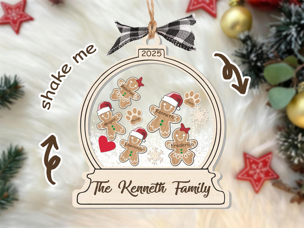 Gingerbread snow globe family ornament on a white faux fur rug