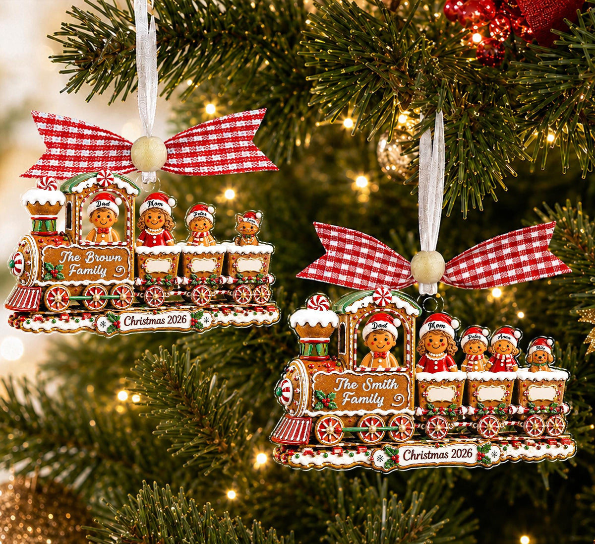 Two personalized gingerbread train ornaments for the Brown and Smith families on a tree