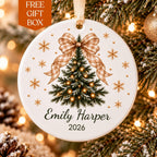 Personalized ceramic Christmas ornament with a beige gingham bow on a tree and Emily Harper 2026